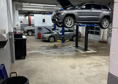Cars being repaired in C&J auto repair service shop