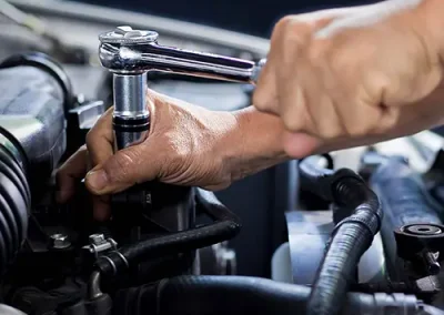 Mechanic working on a vehicle engine