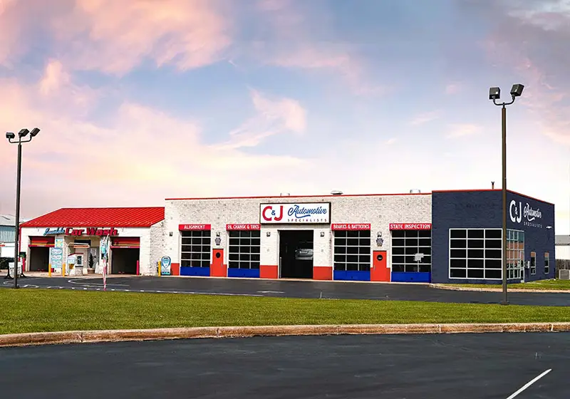 C&J Automotive in Lansdale with multiple service bays for alignment, oil changes and tires, brakes and batteries, and state inspections, alongside an adjacent car wash.